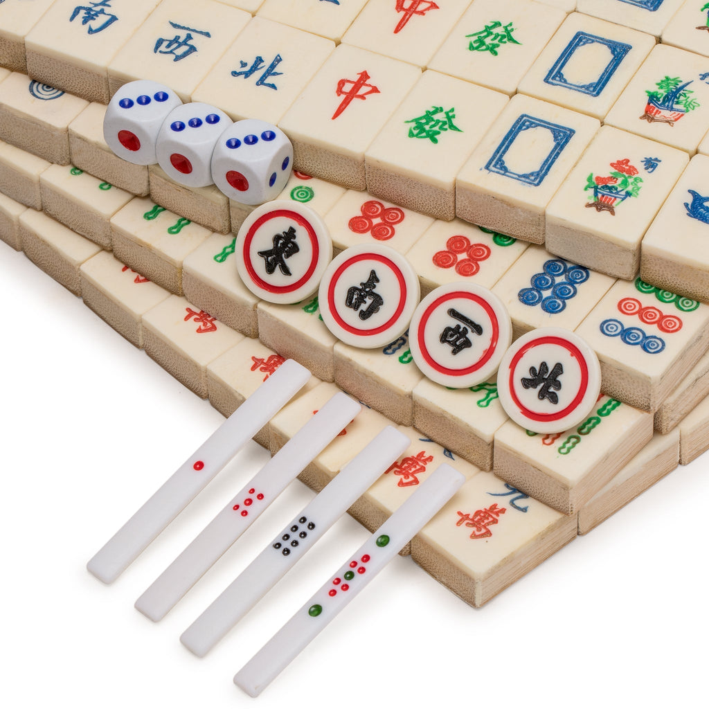 A Chinese Mahjong set, early 20th century, with bone and bamboo tiles,  contained within a five drawe